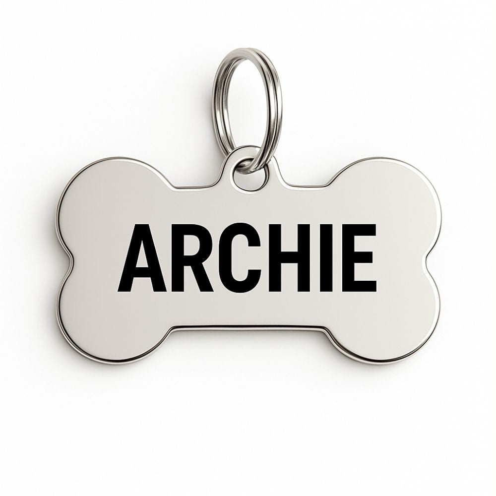 Stainless Steel Dog tag with 'ARCHIE' engraved on a white background